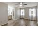 Spacious bedroom featuring wood-look floors, ceiling fan, and two windows with natural light at 3323 Fox Ridge Dr, Winter Haven, FL 33884