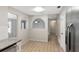 Open concept kitchen and dining room with tile floors and stainless steel refrigerator at 3323 Fox Ridge Dr, Winter Haven, FL 33884