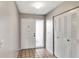 Inviting foyer with tile flooring, coat closet and white front door with sidelight at 3323 Fox Ridge Dr, Winter Haven, FL 33884