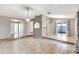 Open-concept living room with tile floors and sliding glass doors to patio at 3323 Fox Ridge Dr, Winter Haven, FL 33884