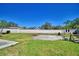 Wide angle backyard shot showing privacy fence, partial block wall, and some space prepped for play or gardening at 3430 Cove E Ct, Winter Haven, FL 33880