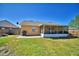 A spacious backyard featuring a grill and a screened-in patio at 3430 Cove E Ct, Winter Haven, FL 33880