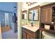 Bathroom with a dark wood vanity and a modern sink at 3430 Cove E Ct, Winter Haven, FL 33880
