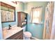 Cozy bathroom featuring a modern sink, vanity, and a stylish shower curtain at 3430 Cove E Ct, Winter Haven, FL 33880