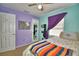 Charming bedroom featuring a colorful blanket and a Winnie the Pooh themed pillow at 3430 Cove E Ct, Winter Haven, FL 33880