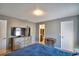 Spacious bedroom featuring a TV, dresser, and an attached bathroom at 3430 Cove E Ct, Winter Haven, FL 33880
