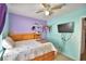 Bedroom with light colored carpet, window and ceiling fan at 3430 Cove E Ct, Winter Haven, FL 33880