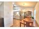 Open-concept kitchen with stainless steel appliances, wood floors, and a dining area at 3430 Cove E Ct, Winter Haven, FL 33880