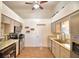 Bright kitchen with stainless steel appliances, and light colored cabinets at 3430 Cove E Ct, Winter Haven, FL 33880