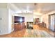 Living room featuring vaulted ceilings, wood-look tile flooring, neutral paint, and an open floor plan at 3430 Cove E Ct, Winter Haven, FL 33880