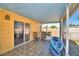 Relaxing screened patio with tiled floor, garden view, and outdoor seating, perfect for enjoying the outdoors at 3430 Cove E Ct, Winter Haven, FL 33880
