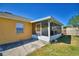 A spacious, screened-in patio offering clear views to a well-maintained yard at 3430 Cove E Ct, Winter Haven, FL 33880