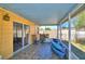 Relaxing screened patio with tiled floor, garden view, and outdoor seating, perfect for enjoying the outdoors at 3430 Cove E Ct, Winter Haven, FL 33880