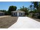 Charming home featuring a new concrete driveway, modern paint, and meticulously maintained landscaping at 3438 Avenue E Nw, Winter Haven, FL 33880