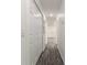 Hallway offers recessed lighting and modern flooring and leads to the living spaces at 3438 Avenue E Nw, Winter Haven, FL 33880