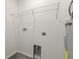 Laundry room featuring modern shelves, a utility sink, and convenient hookups at 3438 Avenue E Nw, Winter Haven, FL 33880