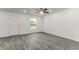 Inviting living space showcases modern flooring, recessed lights, and a seamless flow into the entryway at 3438 Avenue E Nw, Winter Haven, FL 33880