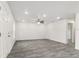 Spacious living room boasts modern flooring, recessed lighting, and an open floor plan at 3438 Avenue E Nw, Winter Haven, FL 33880