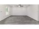 Bright living room featuring modern flooring, recessed lighting, and abundant natural light at 3438 Avenue E Nw, Winter Haven, FL 33880