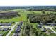 A tranquil view of a community home surrounded by lush greenery and wide-open spaces at 3467 Sutton Ridge St, Lakeland, FL 33810