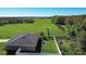Aerial view of a home with a large yard backing up to lush green farmland at 3467 Sutton Ridge St, Lakeland, FL 33810