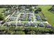 An elevated view of a home in a tranquil neighborhood, complete with a neat lawn and paved driveway at 3467 Sutton Ridge St, Lakeland, FL 33810