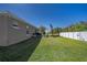 Large, well-maintained backyard with a privacy fence and mature trees, ideal for outdoor activities at 3467 Sutton Ridge St, Lakeland, FL 33810