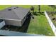 Aerial view of green lawn and fenced backyard at 3467 Sutton Ridge St, Lakeland, FL 33810