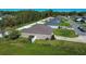 View of fenced backyard with green grass and landscaping at 3467 Sutton Ridge St, Lakeland, FL 33810