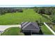 Aerial view of house with a green lawn at 3467 Sutton Ridge St, Lakeland, FL 33810