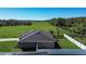 Aerial view of the house, backyard and lawn at 3467 Sutton Ridge St, Lakeland, FL 33810
