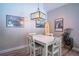 Bright dining room featuring a rustic table, modern light fixture, and unique decorative elements at 3467 Sutton Ridge St, Lakeland, FL 33810