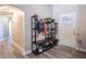 Stylish entryway features modern storage solutions and elegant wood-look flooring, perfect for organization at 3467 Sutton Ridge St, Lakeland, FL 33810
