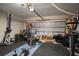 Spacious garage equipped with fitness equipment and a motorcycle for an active lifestyle at 3467 Sutton Ridge St, Lakeland, FL 33810