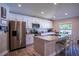 Modern kitchen boasts white cabinetry, granite countertops, and stainless steel appliances at 3467 Sutton Ridge St, Lakeland, FL 33810