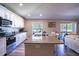 Open kitchen with island and modern appliances at 3467 Sutton Ridge St, Lakeland, FL 33810
