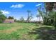 The home features a large grassy backyard at 352 W Graham Park Dr, Haines City, FL 33844