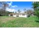 The home features a large grassy backyard at 352 W Graham Park Dr, Haines City, FL 33844