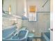 Charming vintage bathroom with original blue fixtures and tile work at 352 W Graham Park Dr, Haines City, FL 33844