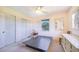 This bedroom boasts natural lighting, a ceiling fan, and mirrored closet doors at 352 W Graham Park Dr, Haines City, FL 33844