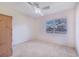 Empty bedroom featuring neutral carpet, a ceiling fan, and natural lighting at 352 W Graham Park Dr, Haines City, FL 33844