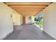 View of the covered carport with an outdoor storage area and access to the backyard at 352 W Graham Park Dr, Haines City, FL 33844