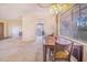 This light dining room features a wooden table next to a bright window at 352 W Graham Park Dr, Haines City, FL 33844