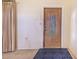 Entryway featuring a decorative wooden door with a glass insert and patterned rug at 352 W Graham Park Dr, Haines City, FL 33844