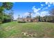 Exterior view of the property surrounded by a spacious, well-maintained lawn at 352 W Graham Park Dr, Haines City, FL 33844