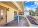 Cozy front porch area featuring comfortable seating and well-maintained landscaping at 352 W Graham Park Dr, Haines City, FL 33844