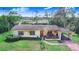 Charming single-story home featuring a well-maintained lawn and covered carport at 352 W Graham Park Dr, Haines City, FL 33844