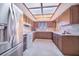 A wide kitchen with stainless steel appliances, wooden cabinets, and bright lighting at 352 W Graham Park Dr, Haines City, FL 33844