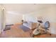 Spacious living room with hardwood floors and exercise equipment at 352 W Graham Park Dr, Haines City, FL 33844