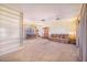 Spacious living room with built-in bookshelves and a large window for natural light at 352 W Graham Park Dr, Haines City, FL 33844
